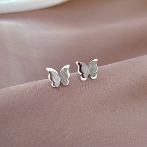 Minimalist silver butterfly stud earrings with sparkling frosted texture for women