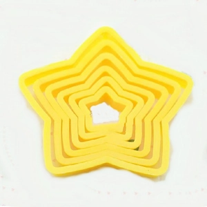 5-piece set of yellow star-shaped plastic cookie cutters in nested sizes for baking