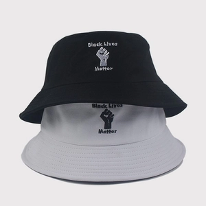 Close-up of black and grey cotton bucket hats with Black Lives Matter embroidery
