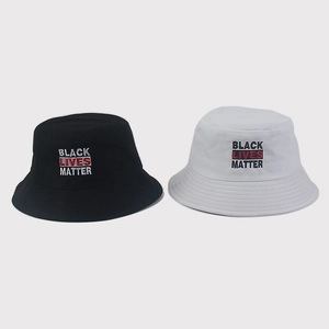 Close-up of Black Lives Matter embroidery on black and white cotton bucket hats