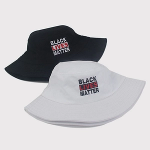 Detailed embroidery of Black Lives Matter slogan on black and white cotton bucket hats