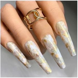 Long coffin marble nails with gold foil flakes on white base for manicure decoration