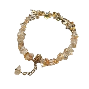 Close-up of irregular natural citrine bead bracelet with golden adjustable chain link