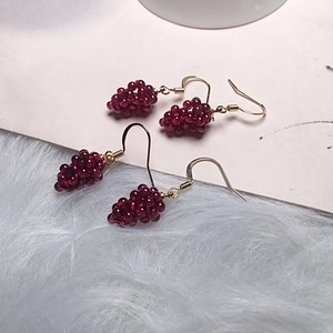Handmade garnet grape earrings featuring dark red beads and gold-plated hooks