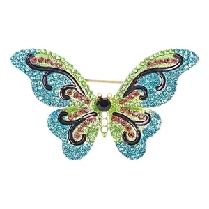 Colorful butterfly brooch pin with sparkling crystal rhinestones on a white background