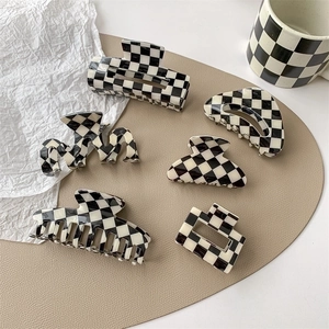 Set of 6 black and white checkered claw clips in various geometric shapes for women
