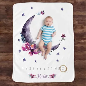 Baby Milestone Blanket with Purple Moon Floral Design on Wood Floor with Mark Ring
