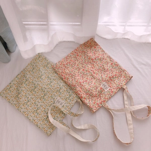 Floral cotton canvas tote bag in yellow and pink patterns with wide shoulder straps