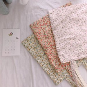 Pastel floral print cotton tote bags in pink and yellow for a sweet aesthetic look