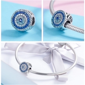 Detailed macro view of 925 sterling silver blue Evil Eye charm showing the S925 hallmark