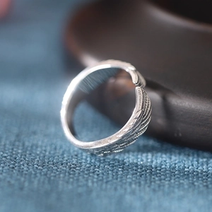 Thai silver angel wing ring for men and women with creative feather design and hip-hop style