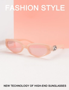 Detailed close-up of pink translucent frame with hexagonal silver rhinestone accents
