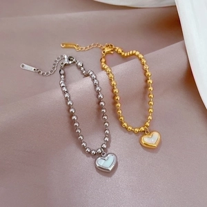 Elegant gold and silver heart-shaped mother-of-pearl bead bracelets in titanium steel