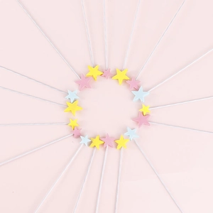 Colorful EVA sponge star cake toppers in pink, yellow, and blue on white sticks