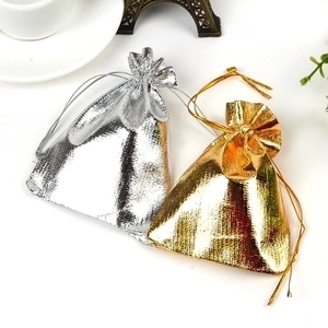 Metallic drawstring gift pouches in gold and silver colors for jewelry storage