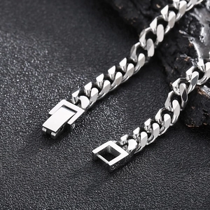 Close-up of a silver titanium steel Cuban chain with a unique square buckle clasp detail