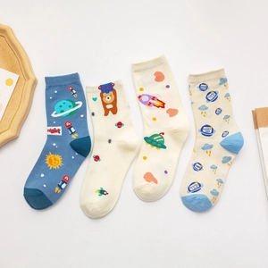 Pack of four cartoon space themed cotton socks featuring astronauts and rockets on white background