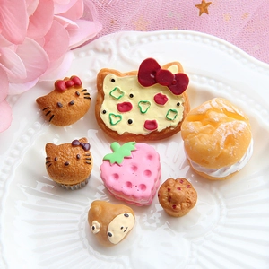 Miniature resin bread and cookie food models on a white plate for DIY crafts decoration
