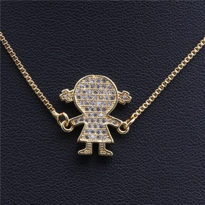 Detailed view of micro-pave zircon girl pendant on gold-plated box chain necklace