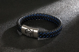 Close-up of woven leather men's bracelet with silver stainless steel magnetic clasp
