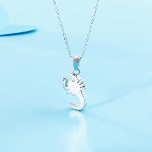Silver scorpion pendant necklace with O-chain on a light blue background, detailed view