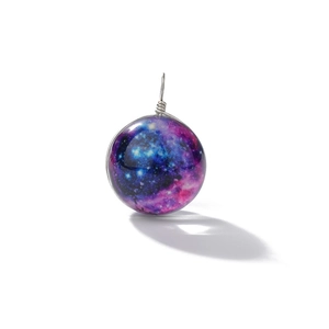 Detail of galaxy glass pendant with purple nebula pattern and silver wire-wrapped loop