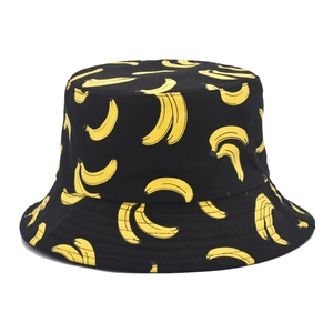 Reversible bucket hat with yellow banana print on black cotton fabric for summer