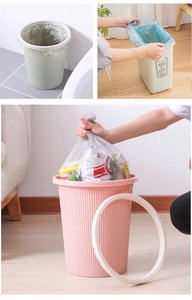 Detail of disposable plastic trash bags being fitted with a fixing ring in various colors