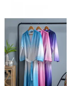 Detailed waffle texture of ombre bathrobes in blue, pink and purple gradient colors