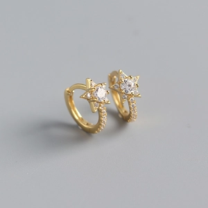Detail of star-shaped S925 sterling silver hoop earrings with sparkling cubic zirconia