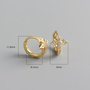 Detail shot of gold cross huggie earrings with diamond inlay and 11.8mm size specs