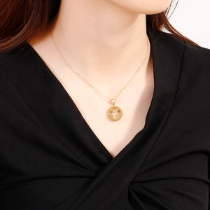 Fashion stainless steel necklace set with cutout angel disc pendant on a female model