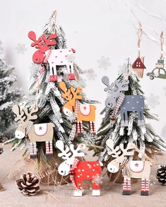 Close-up of wooden reindeer Christmas tree ornaments with heart and star patterns