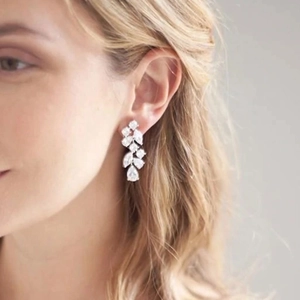 Elegant silver long tassel petal earrings with marquise cubic zirconia on a model