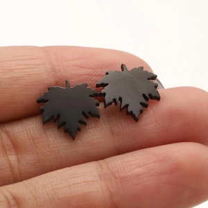 Minimalist black maple leaf stud earrings made of stainless steel for women