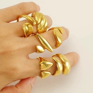 Polished 18k gold plated stainless steel rings set featuring heart and textured designs
