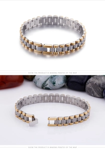 Detail of silver and gold stainless steel president link bracelet with folding clasp