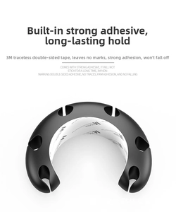 Detailed macro view of 3M adhesive backing on a black silicone cable management clip