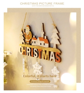 Detail of wooden Christmas door hanger featuring Santa, pine trees, and snow bells