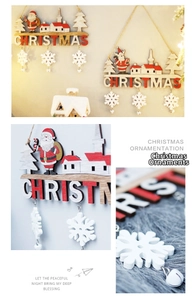 Detail of wooden Christmas door hanger with Santa Claus, church, and snowflakes