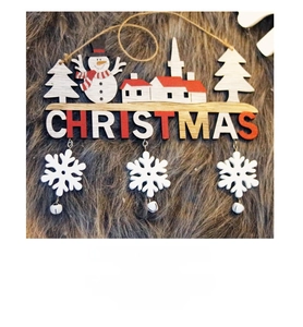 Detail of wooden Christmas door hanger with snowman, tree and hanging white snowflakes