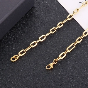 Detailed close-up of a golden titanium steel chain with a secure lobster clasp