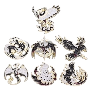 Mythical animal enamel pin set including dragon and phoenix with elegant black and white finish