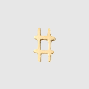 Close-up of golden stainless steel hashtag symbol charm for DIY jewelry making