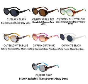 Macro view of vintage oval sunglasses frames with colorful patterns and gradient lenses