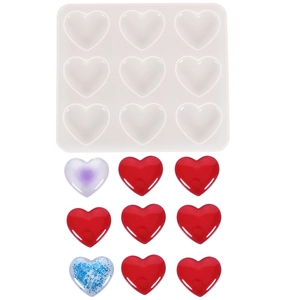 Silicone heart mold for DIY resin and cake with nine finished heart shapes on white background