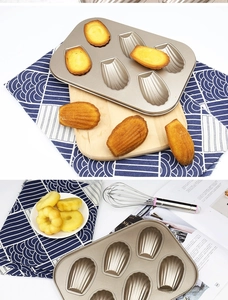 Detail of 6-cup champagne gold shell-shaped Madeleine baking pan with non-stick coating