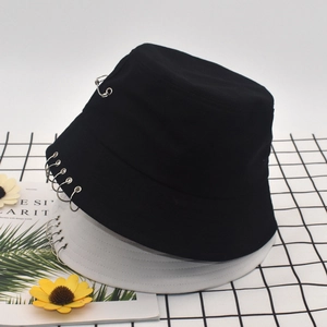 Detail view of cotton bucket hats with punk metal rings in black and white styles