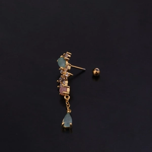 Detailed shot of golden screw-back stud earring with pink and green teardrop crystals