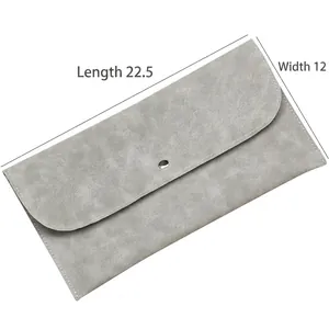 Grey faux suede envelope cosmetic bag with magnetic closure, measuring 22.5 by 12 cm